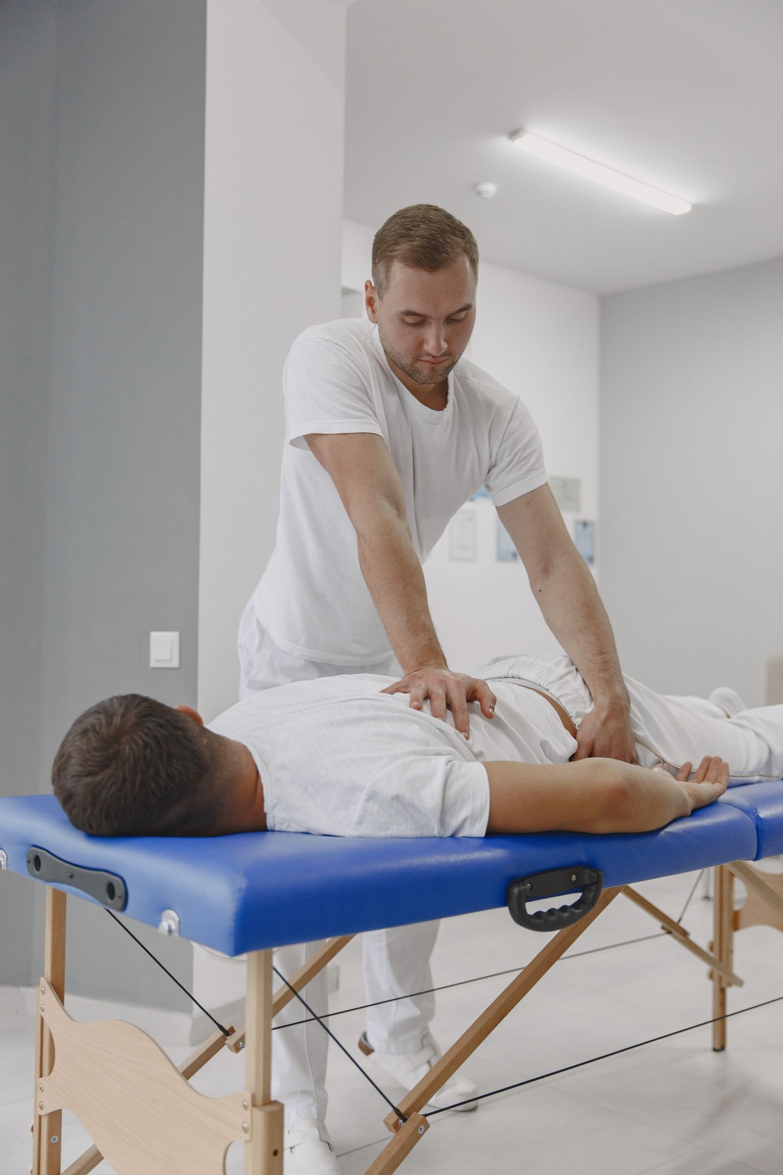 A chiropractor conducting a therapy session