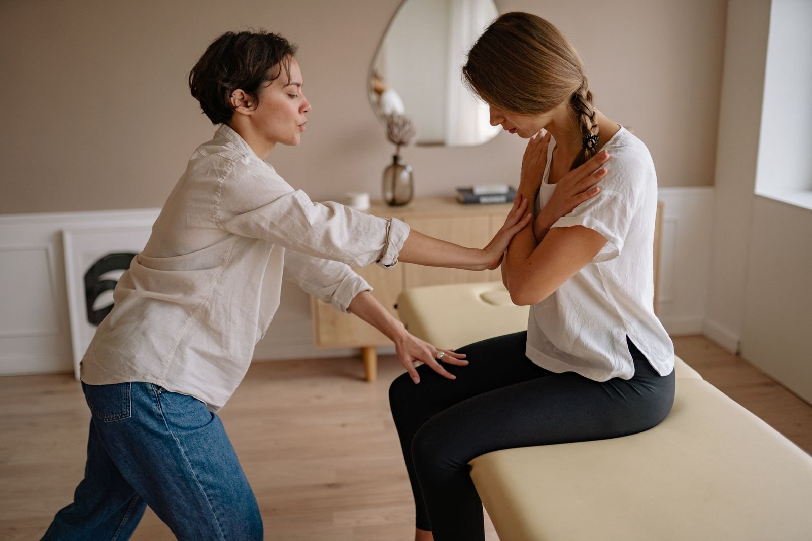 A therapist assisting a patient during a treatment session